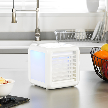 A Beldray Ice Cube Plus Personal Space Cooler on a kitchen worktop