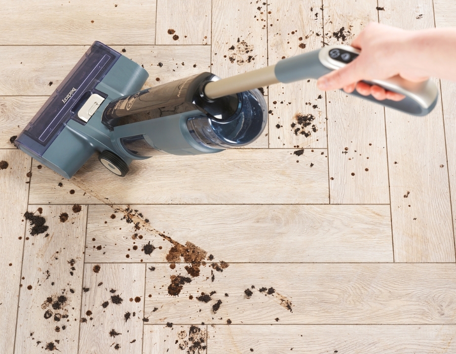 using a modern all-in-one model to clean away muddy marks on a wooden floor