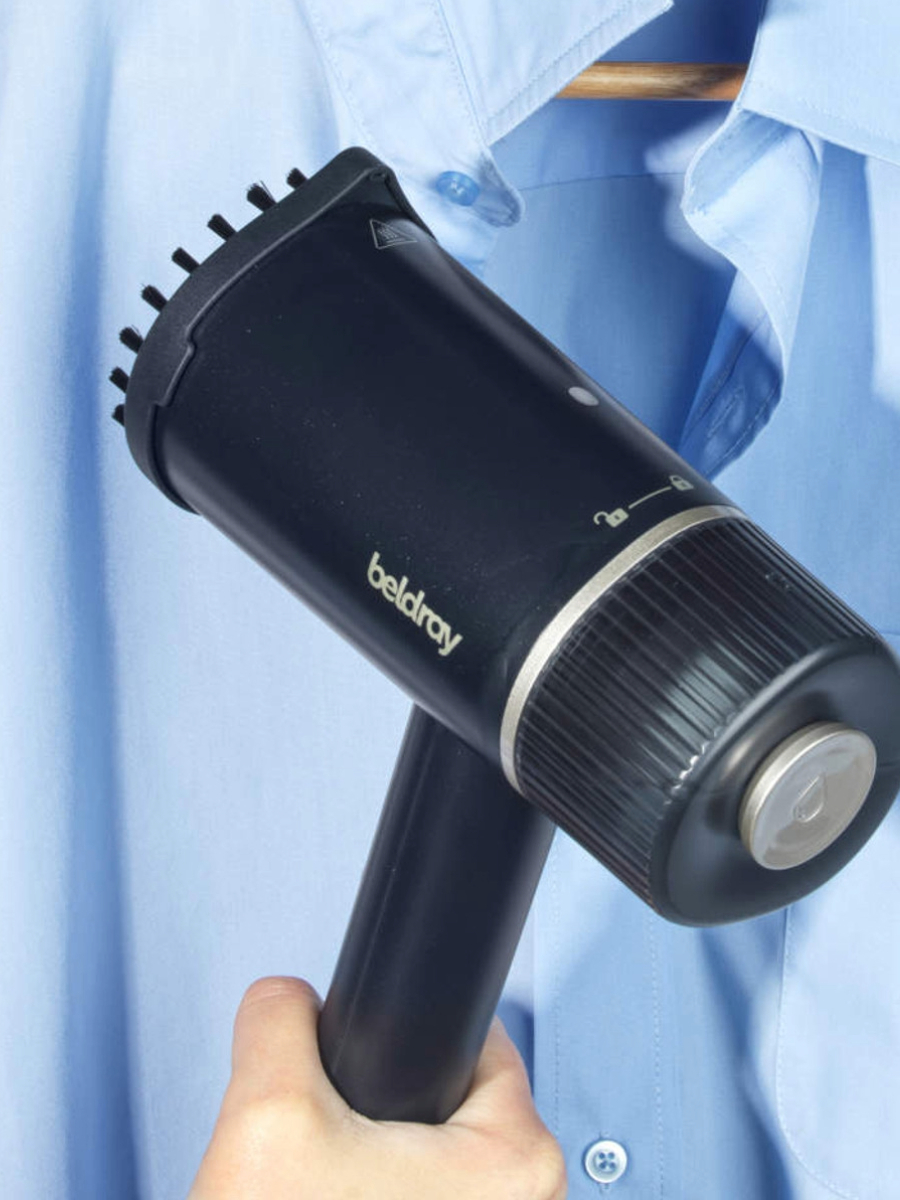 a-garment-steamer-steaming-a-blue-shirt