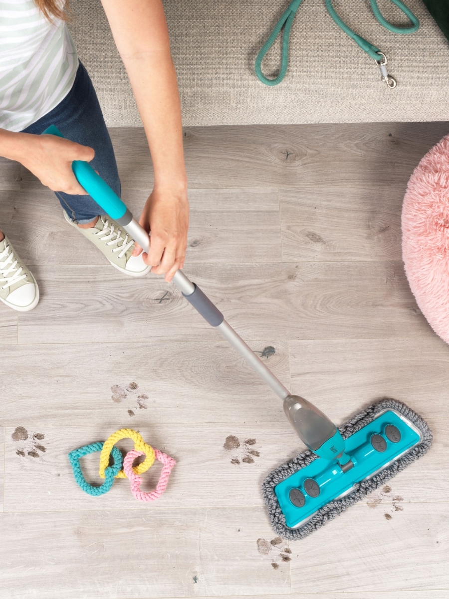 spray mop cleaning muddy paw prints