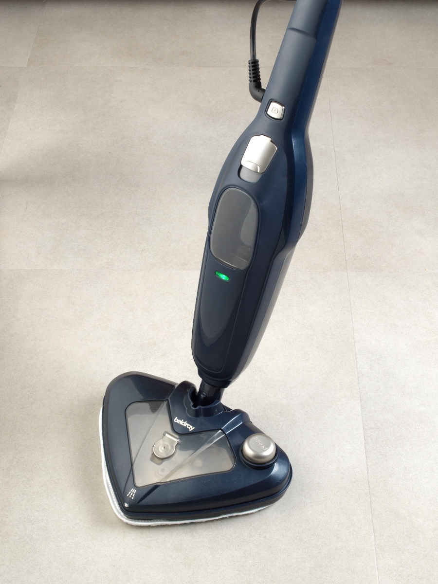Upright steam cleaner on tiled flooring